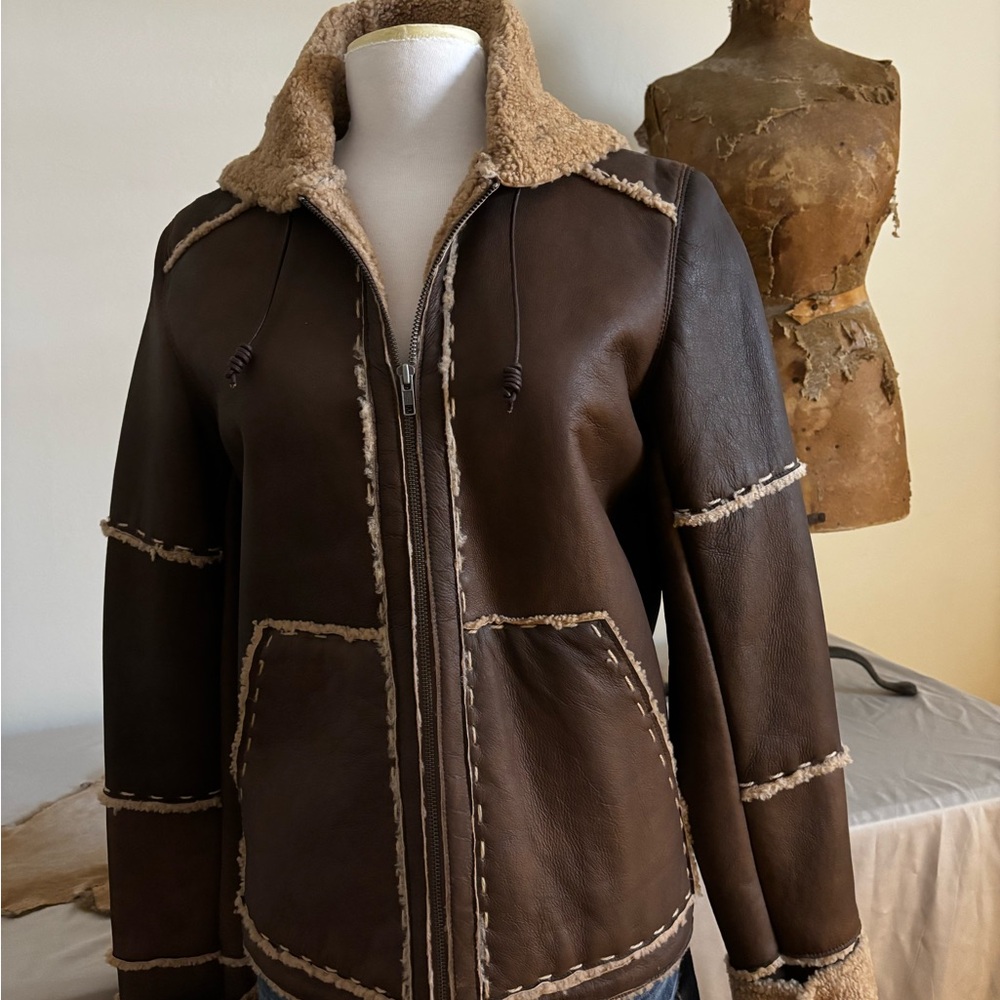 Leather Sherling jacket by Sundance
Hooded with detailed stitching